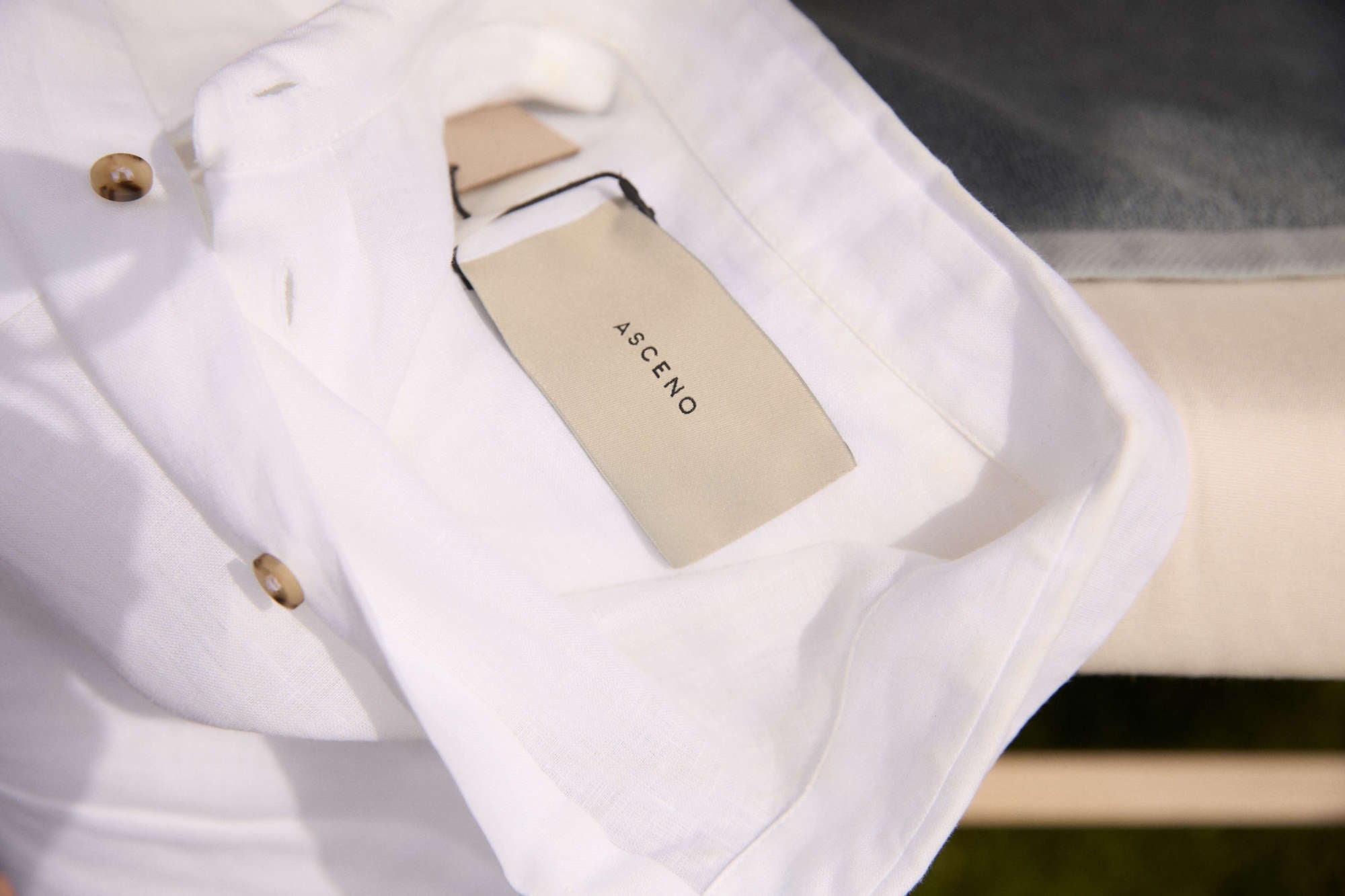 What are three touch-and-drape checks to identify premium fabric?