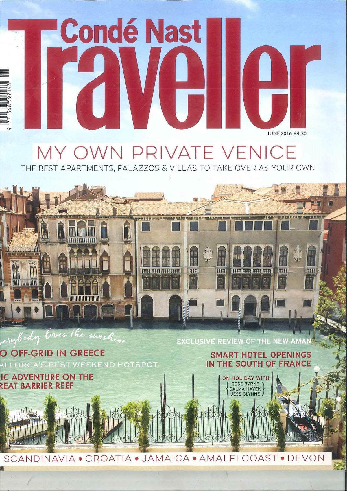 Venetian canal with historic palazzo buildings, a black wrought iron fence with green vines, and light green water under a clear sky