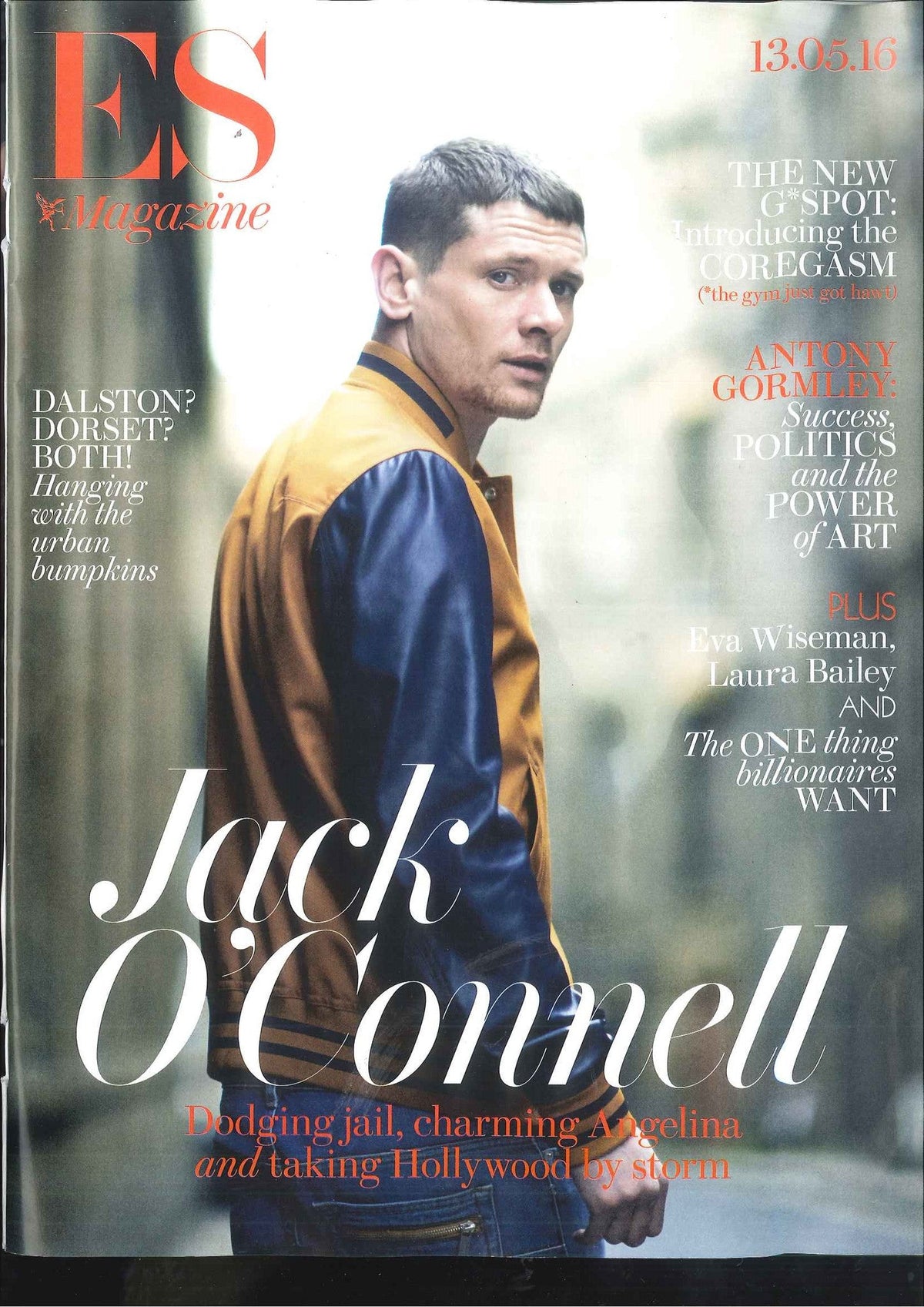 Magazine cover featuring a man in a tan and navy varsity jacket looking over his shoulder outdoors on a blurred street