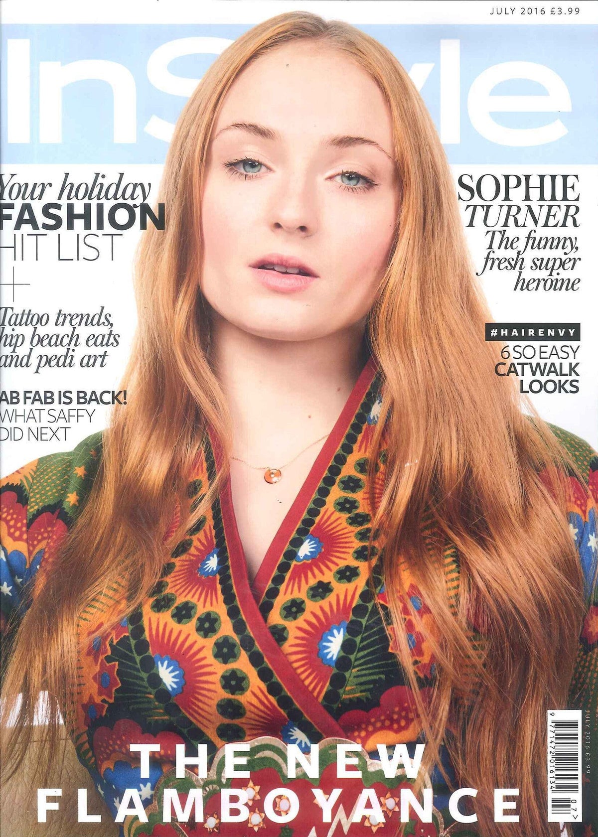 Close-up of a woman with long reddish-blonde hair wearing a vibrant multicoloured floral patterned robe collar