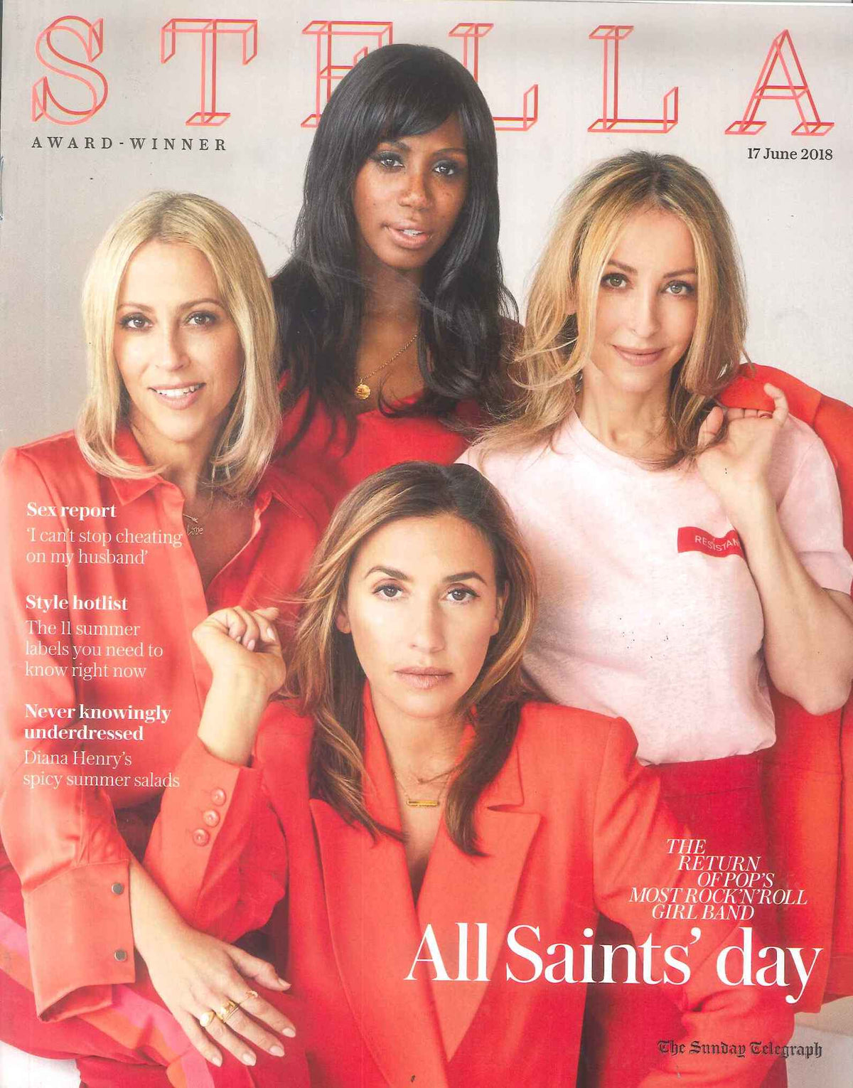 Four women posed together wearing bright red jackets and a pale pink top with a red label against a light background