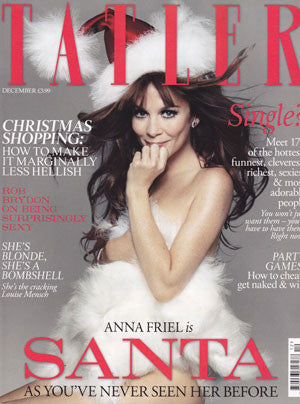 Woman dressed as a glamorous Santa in a white feathered dress and red Santa hat on a Tatler magazine cover