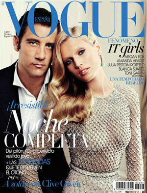 Magazine cover with man in black blazer and woman with long blonde hair in shimmering dress